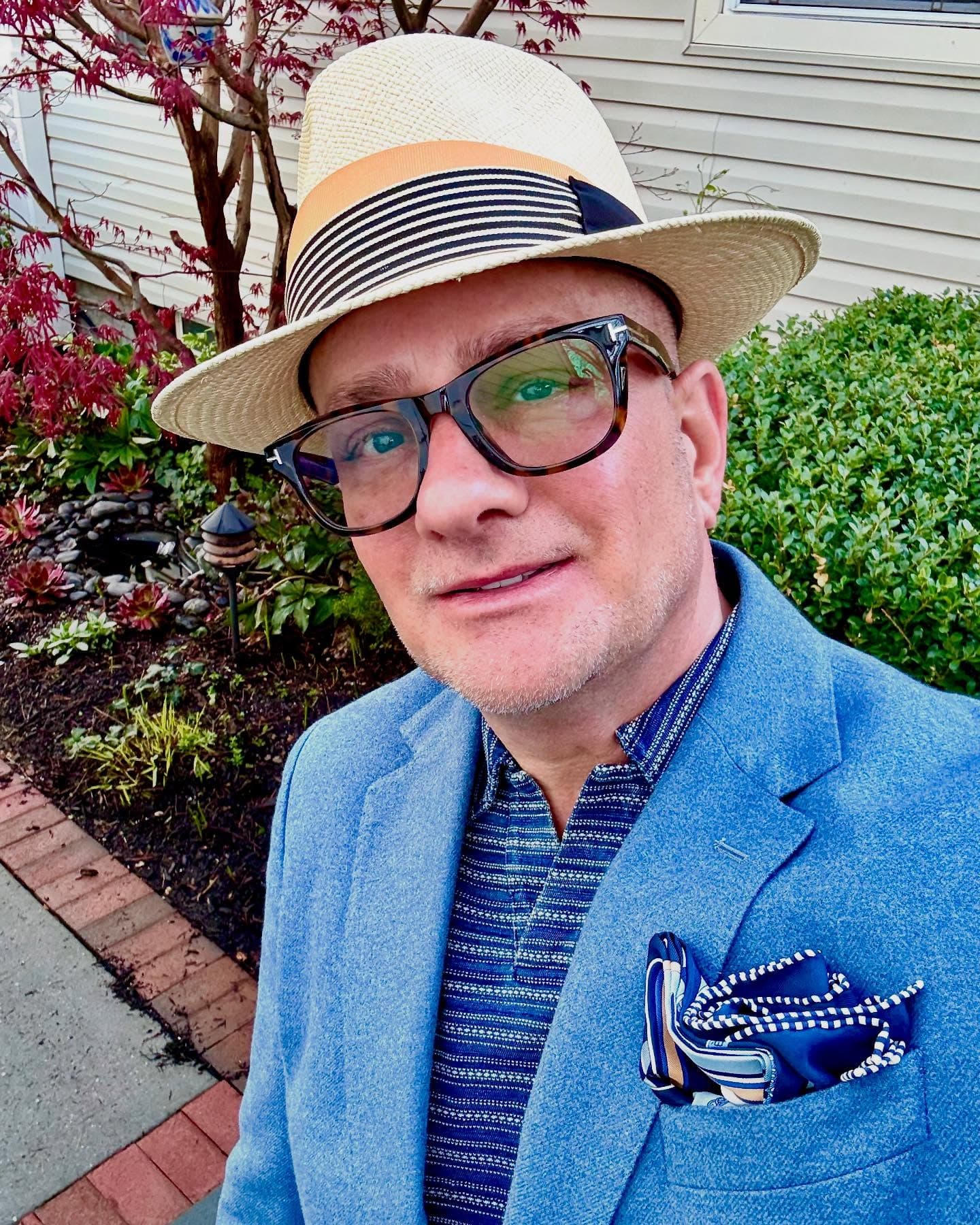 Joseph DeVito portrait, straw hat and blue jacket, outside a house